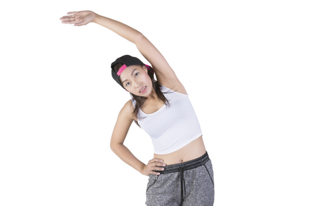 Fitness female posing against white の写真素材