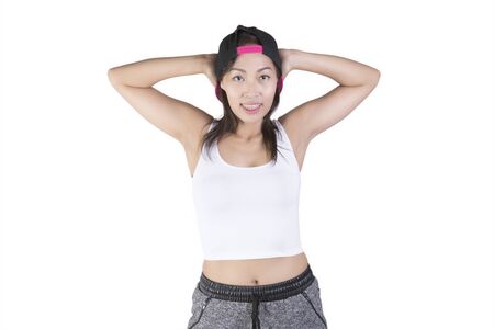 Fitness female posing against white の写真素材