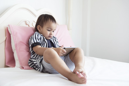 Kids are playing in the living room.の写真素材