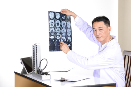 Doctor examine patient data in the office.の写真素材