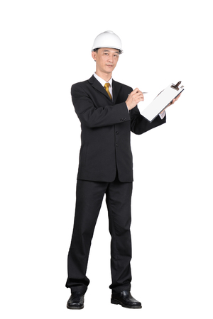 Asian young engineer write clipboard isolated on white backgroundの写真素材