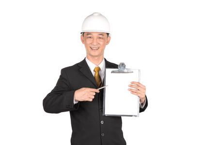 Asian young engineer write clipboard isolated on white backgroundの写真素材