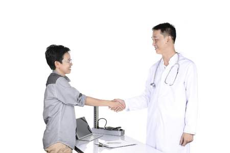 Doctor checking patient in the examination room.の写真素材