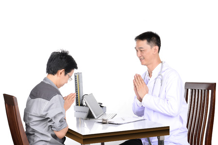 Doctor checking patient in the examination room.の写真素材