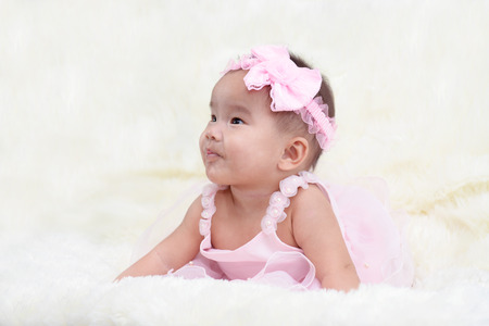 Baby dressed in a beautiful princess in the living room.の写真素材