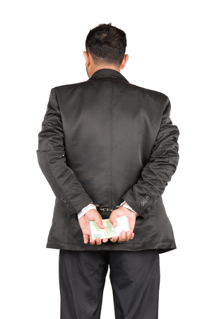 Embezzlement causing damage to the country.の写真素材