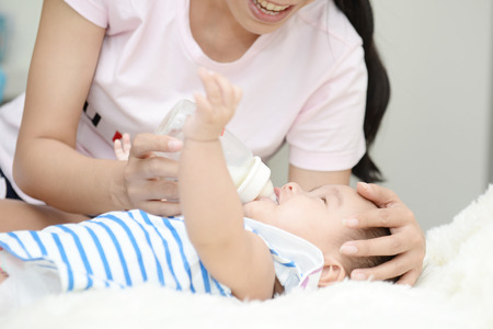 Baby and Mom : Moments of happiness between mother and child.の写真素材