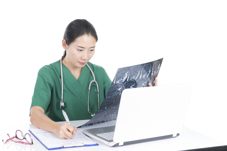 Doctor examine patient data in the office.の写真素材