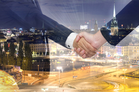 Teamwork for success of the business in the future. Double Exposure of handshake.の写真素材