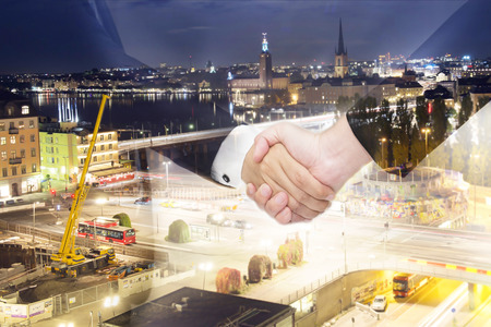 Teamwork for success of the business in the future. Double Exposure of handshake.の写真素材