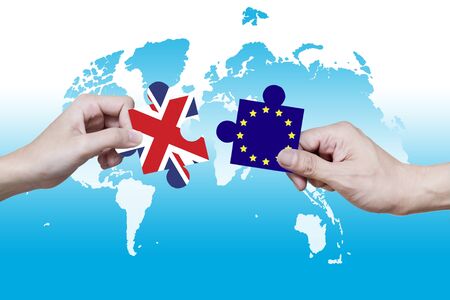 Picture puzzles of the UN and the EU have been pulled apart.の写真素材