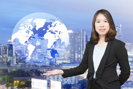 Businesswoman with maps and globes.の写真素材