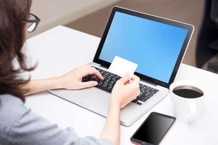 Pay & financial transactions simpler through credit cards and on-line systems. Clipping path at credit card on fileの写真素材