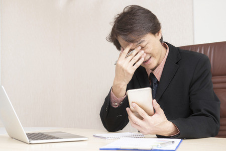 Young asian businessman working in an office.の写真素材