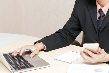 Young asian businessman working in an office.の写真素材