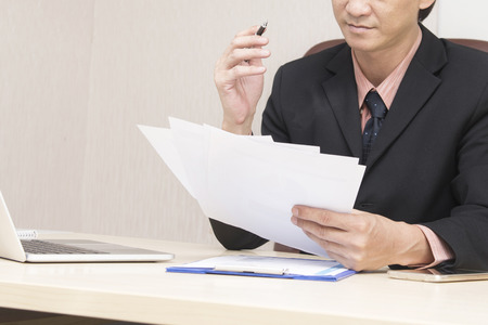 Young asian businessman working in an office.の写真素材