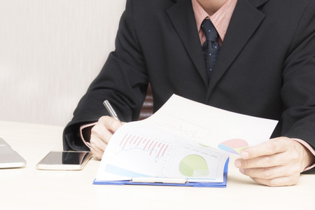 Young asian businessman working in an office.の写真素材