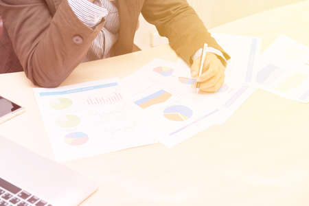 Young businessman writing graph of imagination, Double exposure image.の写真素材