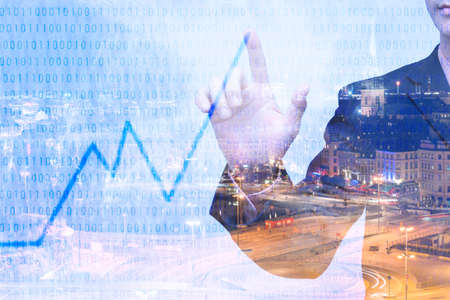 Young businessman writing graph of imagination, Double exposure image.の写真素材