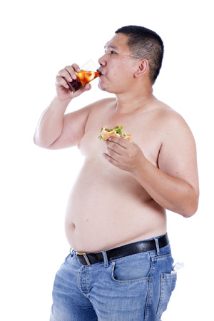 Belly fat people at large from eating behaviors. Junk food. Enjoy eatingの写真素材