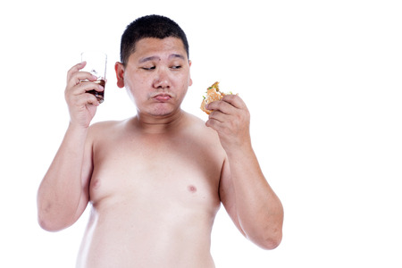 Belly fat people at large from eating behaviors. Junk food. Enjoy eatingの写真素材