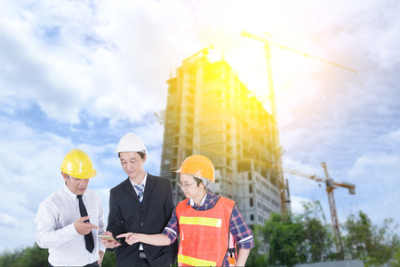 Engineer, supervisor and staff are checking the building construction.の写真素材