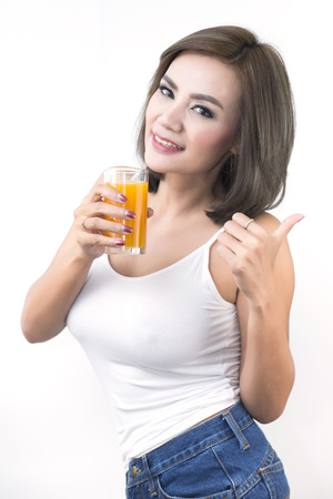 Beautiful women who pay attention to health by drinking the juice.の写真素材