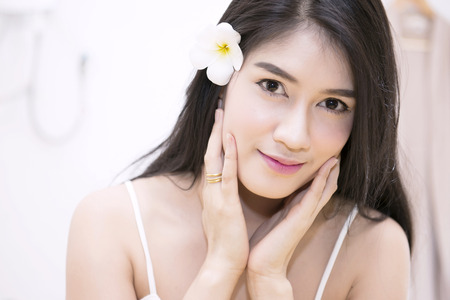 Women pay attention to health and beauty. The spa facial and body massage.の写真素材