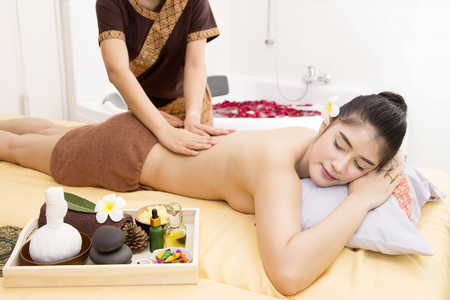 Women pay attention to health and beauty. The spa facial and body massage.の写真素材