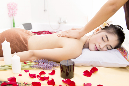 Women pay attention to health and beauty. The spa facial and body massage.の写真素材