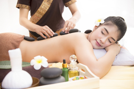 Women pay attention to health and beauty. The spa facial and body massage.の写真素材