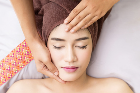 Women pay attention to health and beauty. The spa facial and body massage.の写真素材