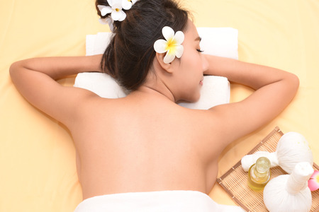 The spa facial and body massage. Women pay attention to health and beauty.の写真素材