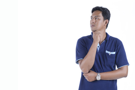 Picture of a young man's thinking, isolated on white background.の写真素材