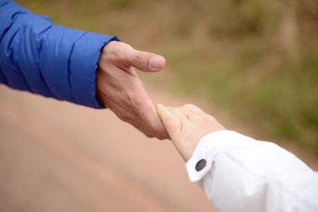 Couples holding hands, walking together happily.