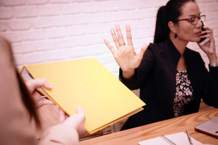 Do not disturb: Businesswoman are important work through telephone contact.の写真素材