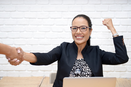 Business people shaking hands to congratulate the agreement.の写真素材