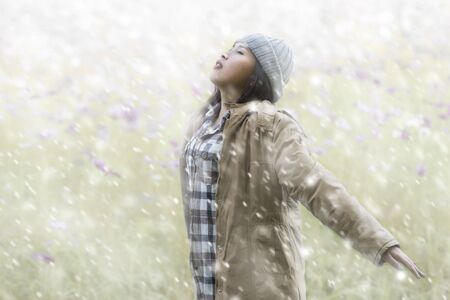Beautiful women are enjoying a winter snow.の写真素材