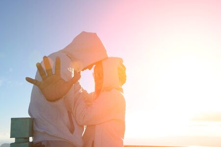 Silhouette of couples happy at scenic mountain fog and sun.の写真素材
