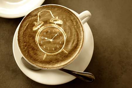 Coffee with clock in the form of overlapping images and light.の写真素材