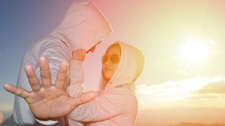 Silhouette of couples happy at scenic mountain fog and sun.の写真素材