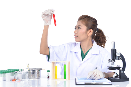 Researchers are examining the trial and evaluation.の写真素材