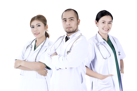 Team surgeon determined on a white background.の写真素材