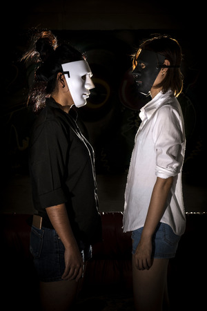 Woman concealed under the guise of white and black.の写真素材