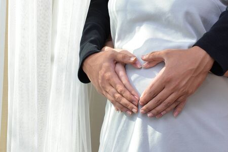 Women are pregnant happy when thinking about the upcoming baby.の写真素材