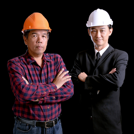 Engineer and supervisors on a black background.の写真素材