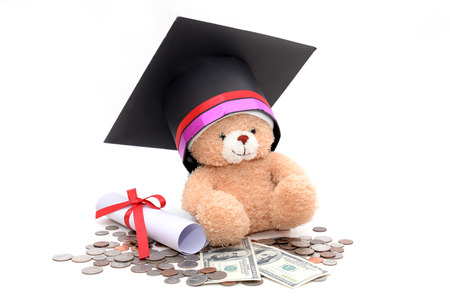 Congratulation concept: Teddy bear with a graduation hat With the concept of scholarship fundingの写真素材