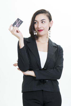 Businesswoman with credit card on a white backgroundの写真素材