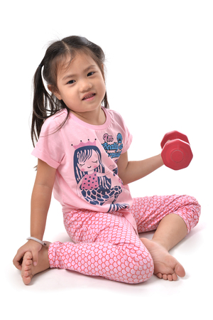 Young children are playing with dumbbell on white backgroundの写真素材