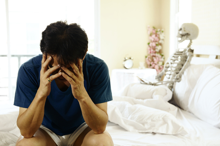 The young man is the stress of having marital problems with sexualityの写真素材